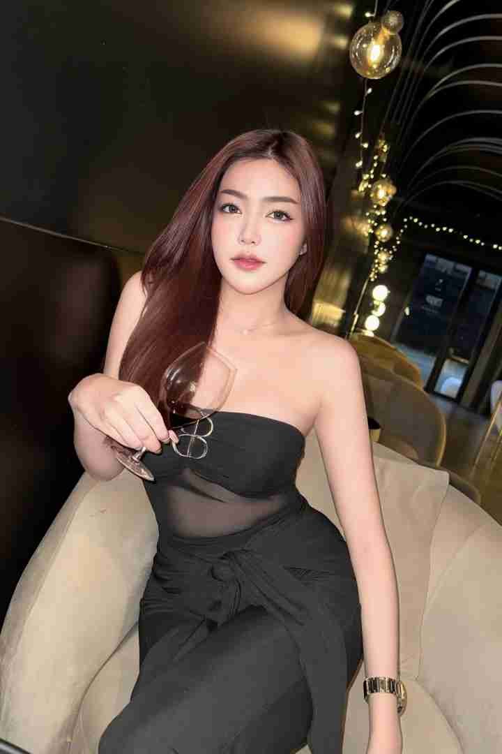 Malay Escort Girl Elegant woman in black dress holding a wine glass, Blog Home