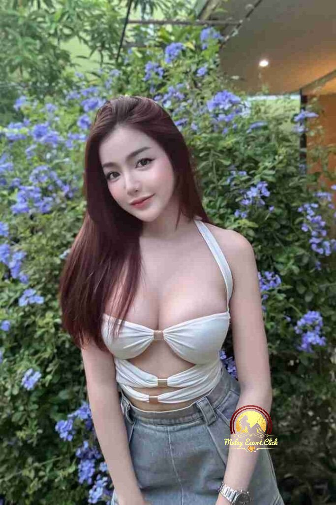 Malay Escort Girl Attractive Asian woman in a camisole top.